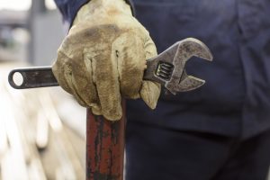 Man holding a wrench